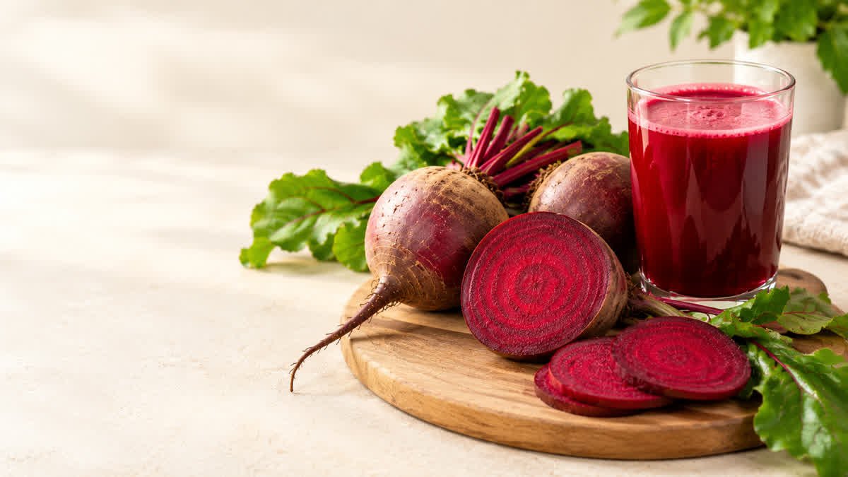Fresh beetroot and a glass of beetroot juice for an article about blood pressure